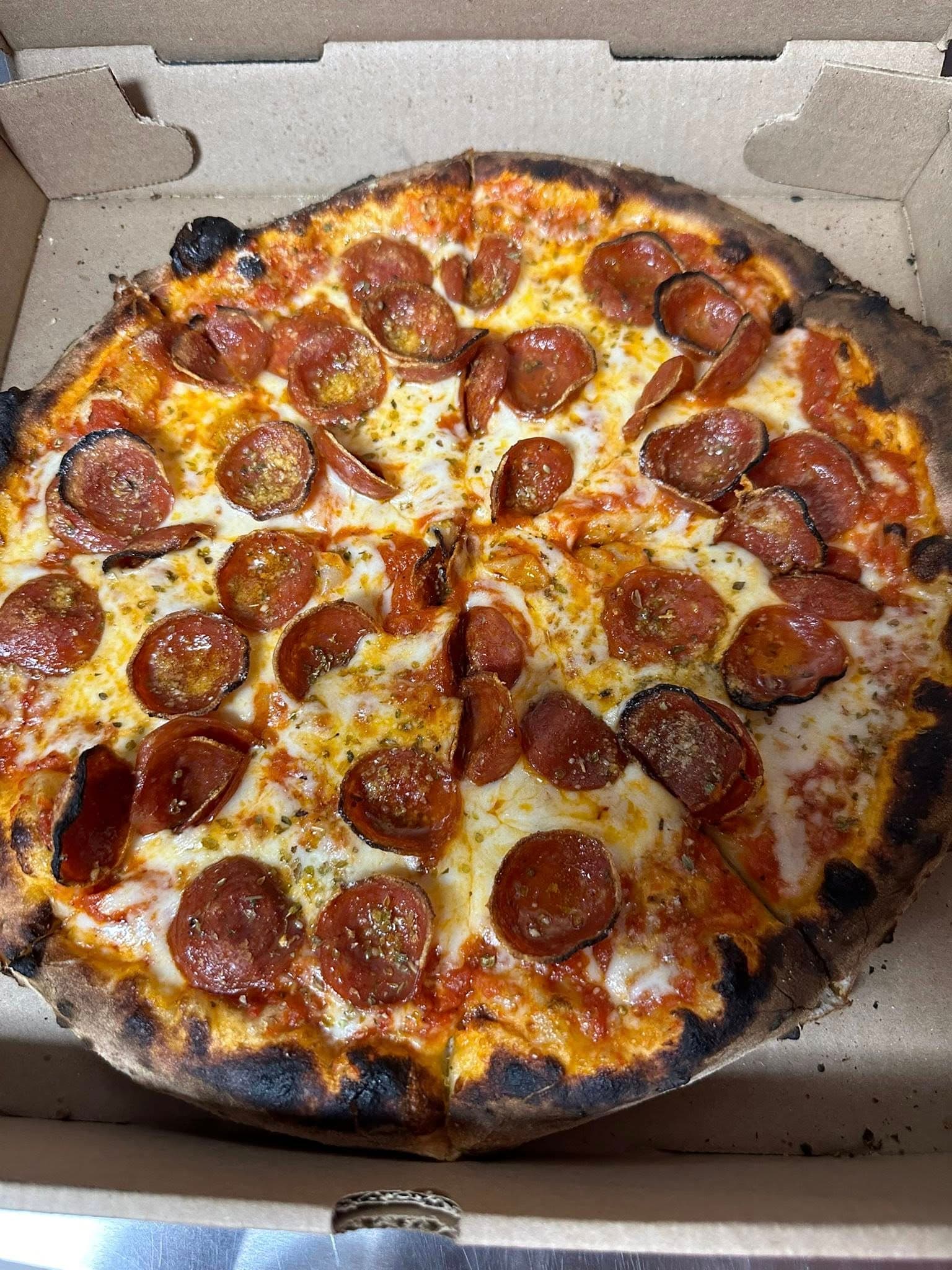 Pepperoni pizza charred