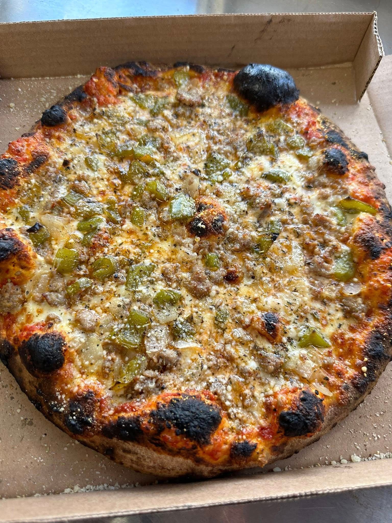 Sausage pepper pizza charred